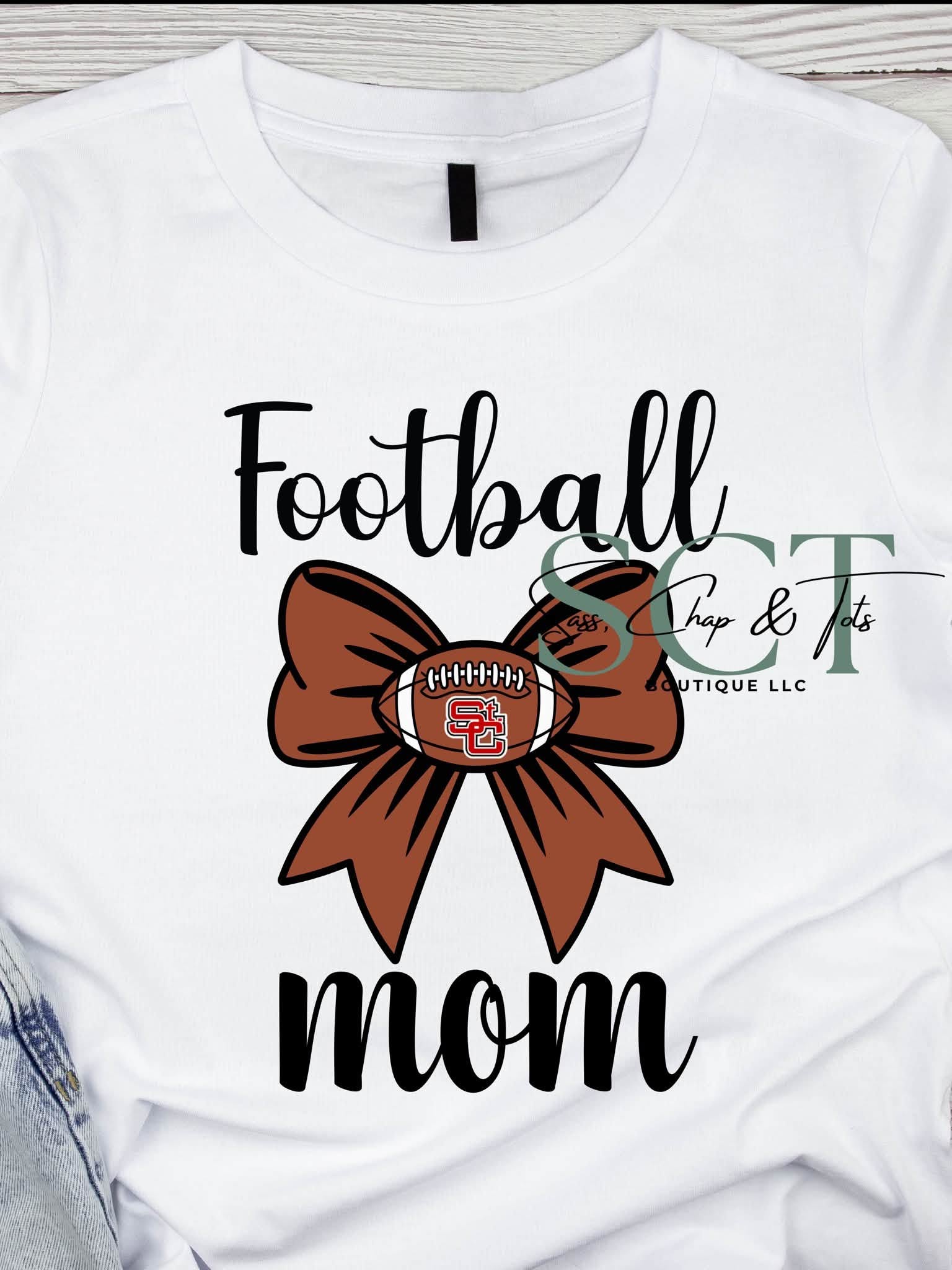 White graphic tee with Football Mom script and football bow featuring St. Clairsville Red Devils logo