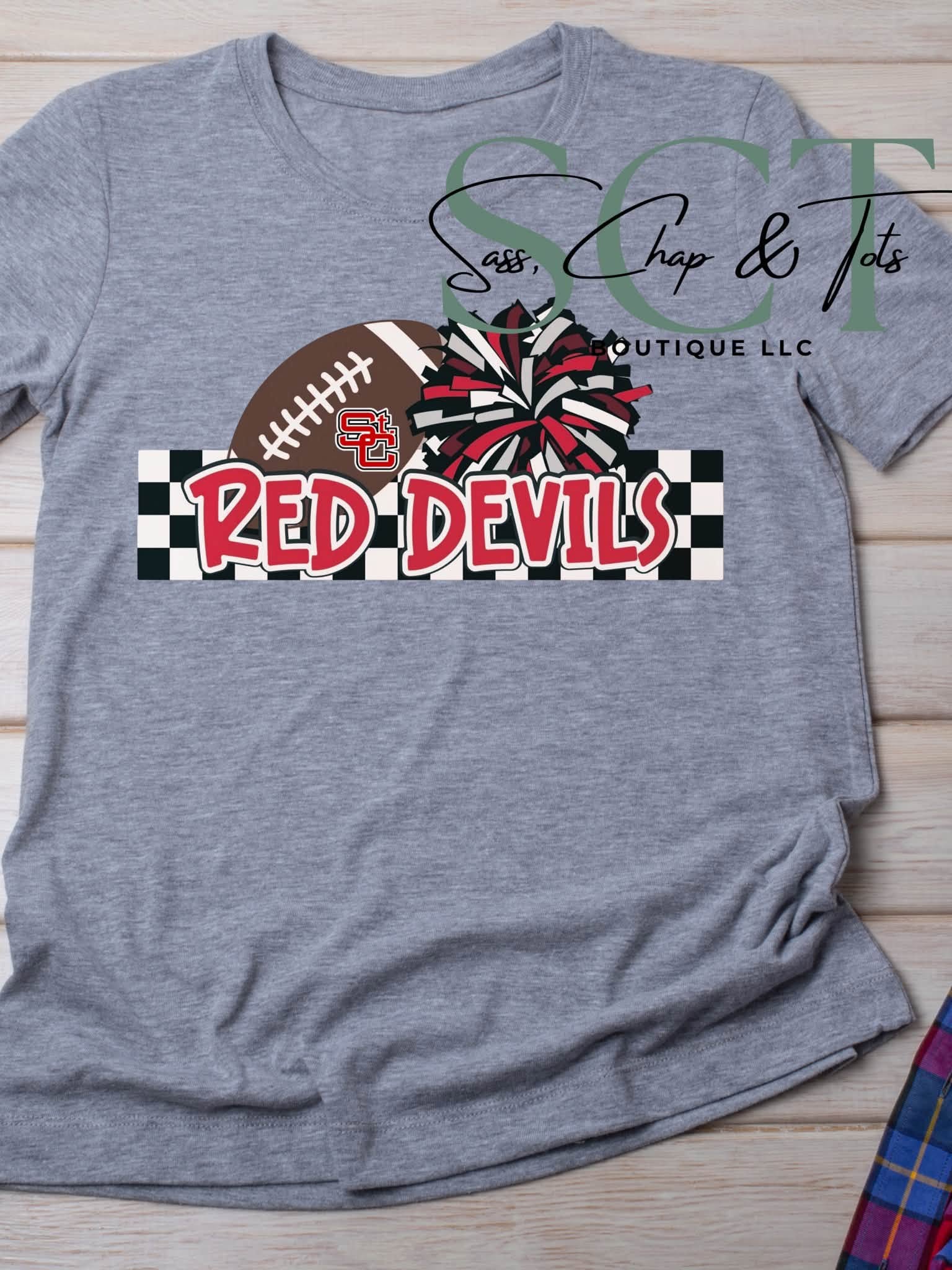 Heather gray graphic tee with Red Devils football and pom-pom design on black and white checkered banner