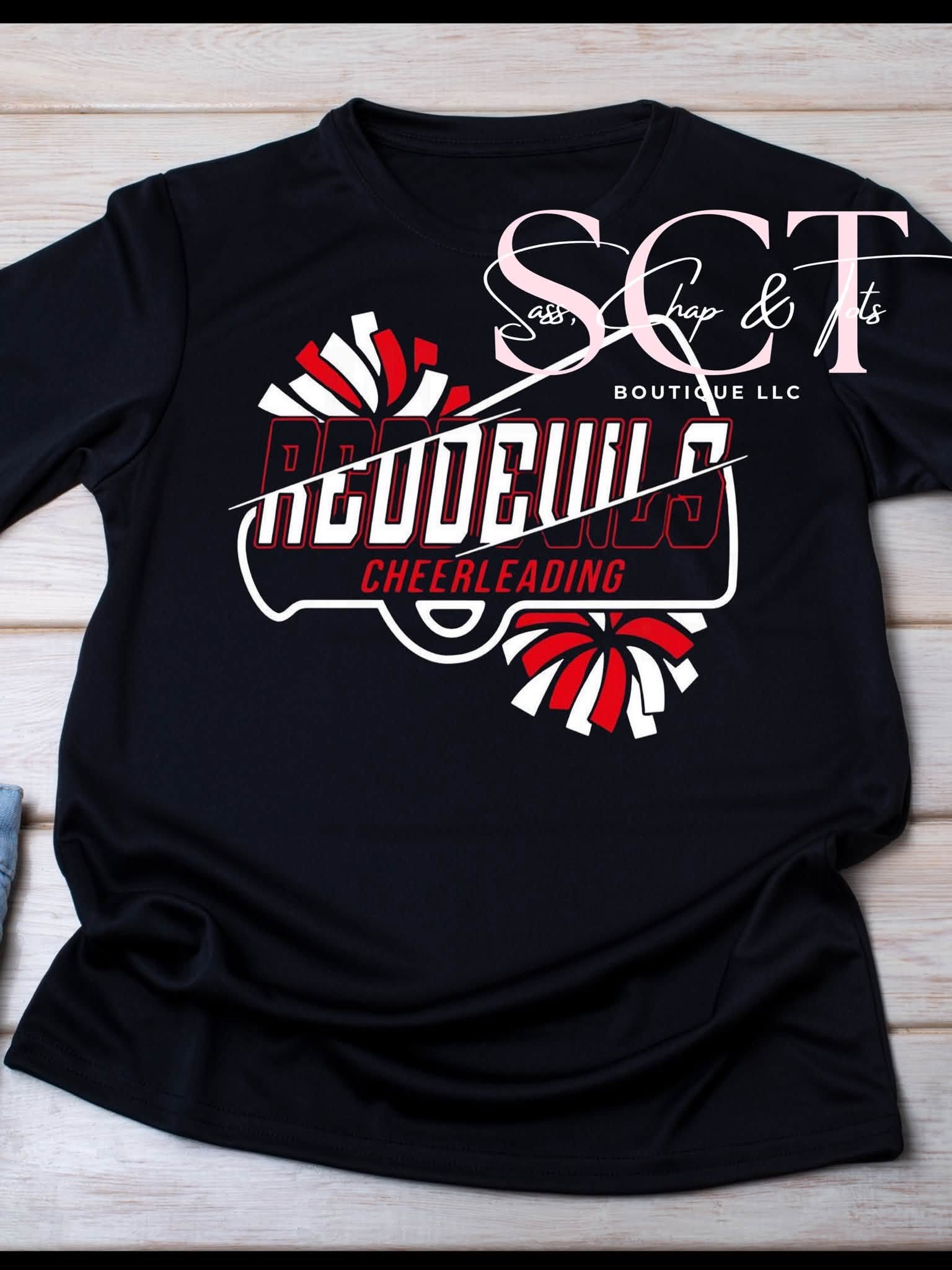 Black graphic tee with Red Devils Cheerleading megaphone design and red and white pom-poms